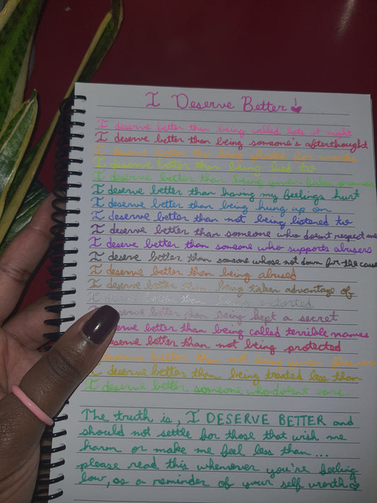 Picture of a notebook with the poem written in colourful cursive ink.