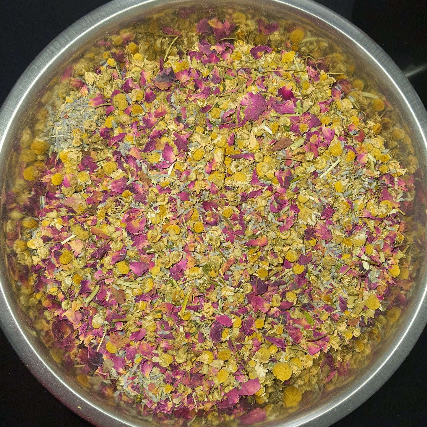 Sleep blend herbal loose leaf tea featuring a harmonious mixture of dried chamomile, passion flower, rose petals, and lavender herbs. This blend offers a soothing and aromatic infusion, perfect for relaxation and promoting a peaceful night's rest.