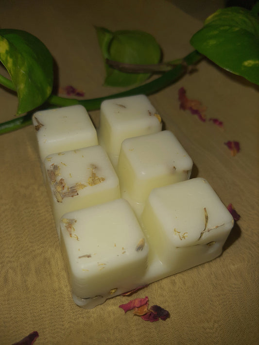 "Lavender and lemon soy wax melts adorned with dried lavender and chamomile herbs. The wax melt emits a soothing aroma, while the herbs add a natural touch of beauty and relaxation."