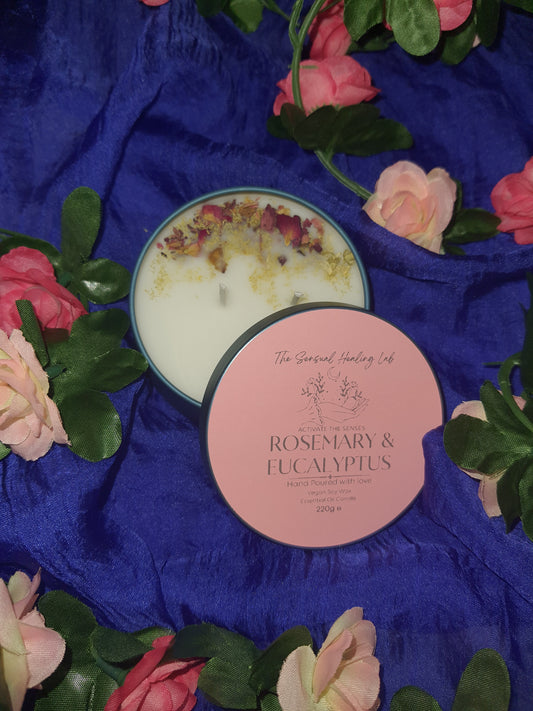 "Rosemary and eucalyptus soy wax candle embellished with dried rose petals and chamomile herbs. The candle releases an invigorating scent, complemented by the visual charm of dried botanicals, creating a harmonious sensory experience."