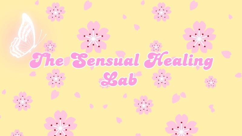Decorative banner with 'The Sensual Healing Lab' text on a yellow background with pink flowers and a butterfly.