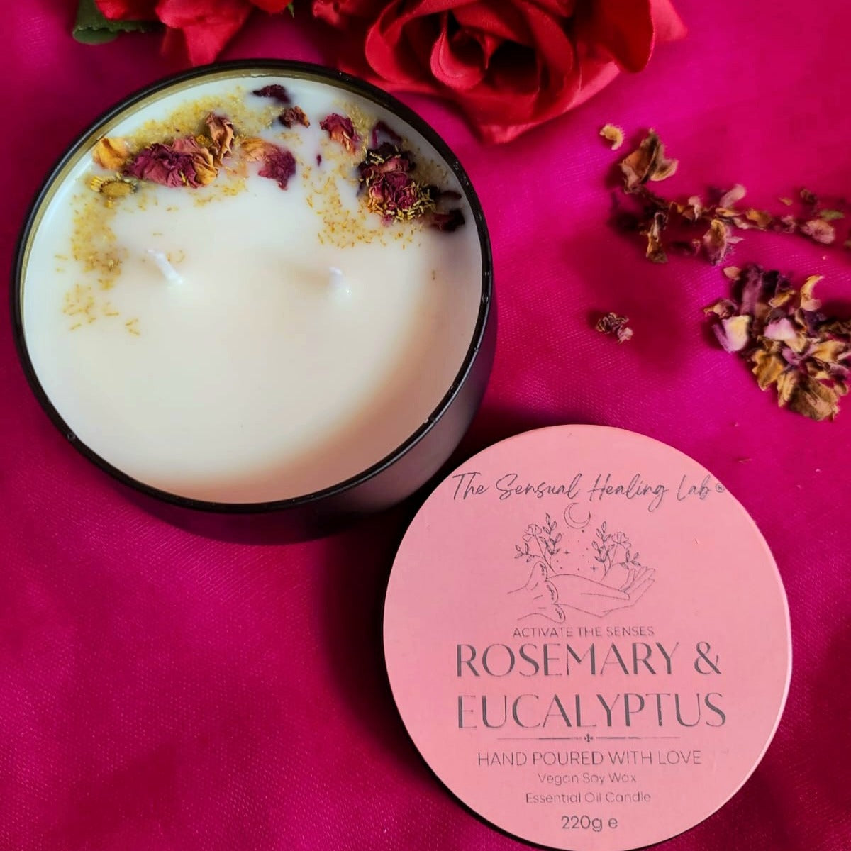 Rosemary and eucalyptus soy wax candle embellished with dried rose petals and chamomile herbs. The candle releases an invigorating scent, complemented by the visual charm of dried botanicals, creating a harmonious sensory experience.